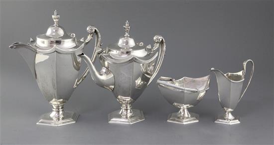A George V silver four piece silver tea set, by Walker & Hall, gross 66.2 oz.